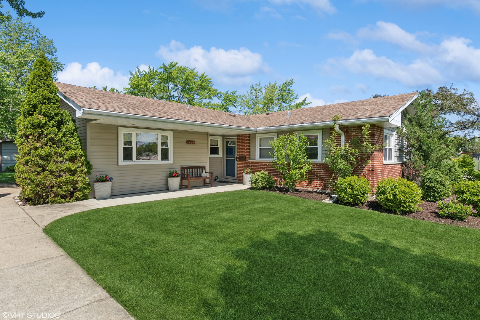 a front view of a house with garden