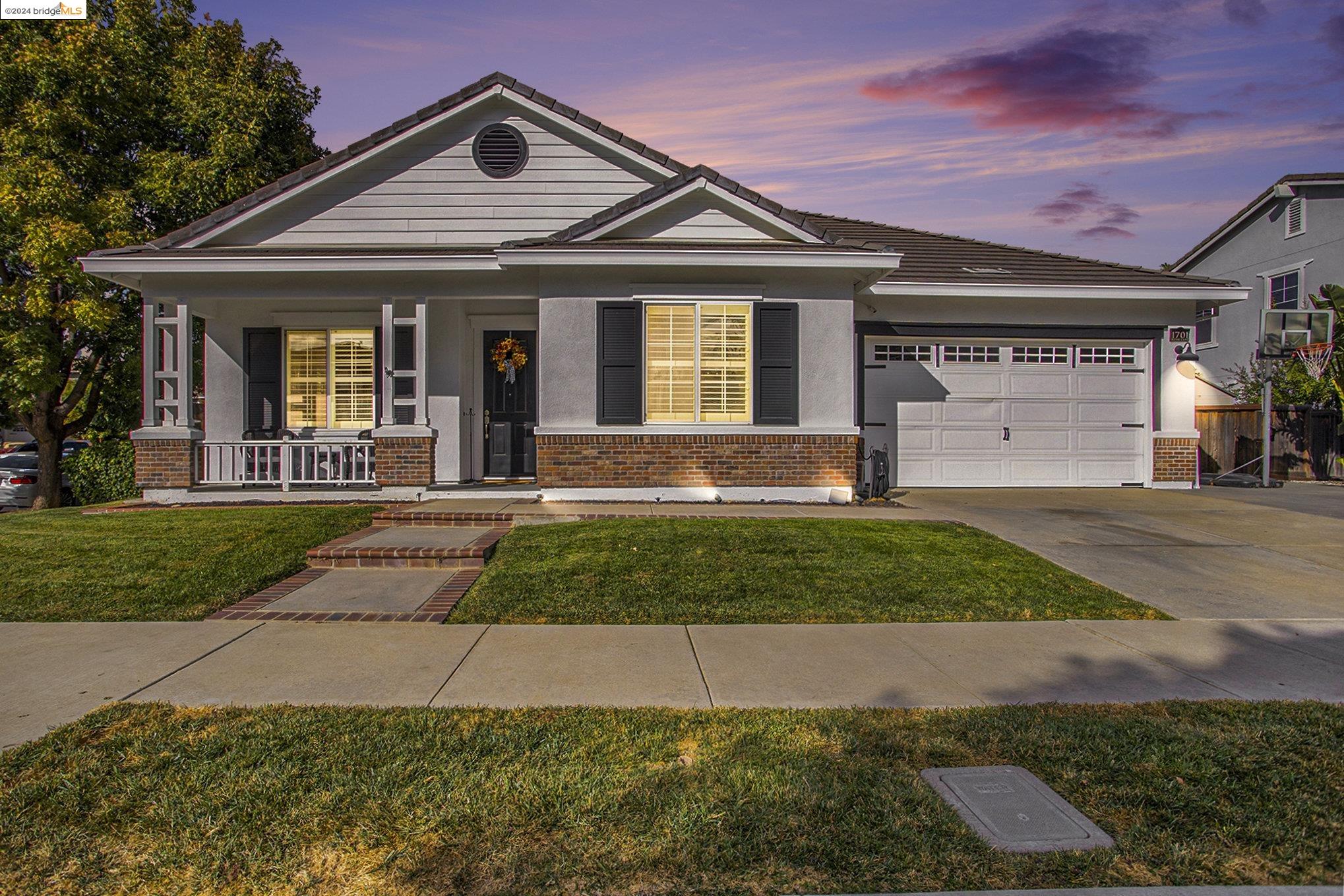 front view of a house with a yard