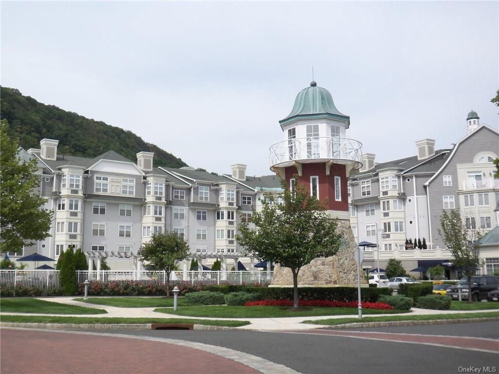 a front view of a building with a yard