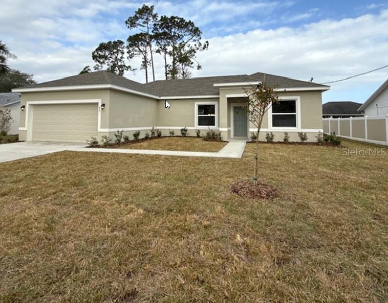 front view of a house with a yard