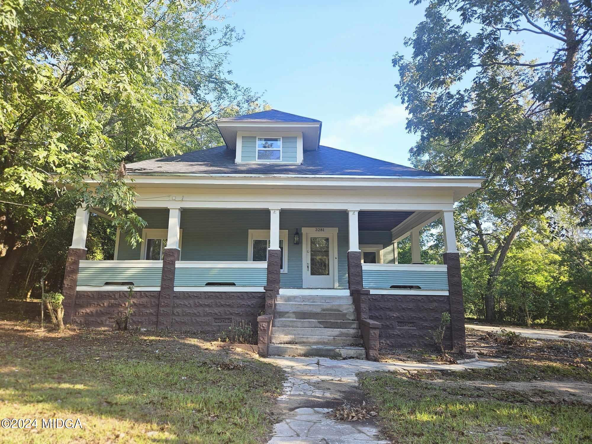 front view of a house with a yard