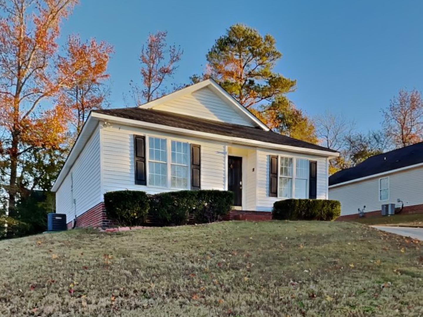 a front view of a house with a yard