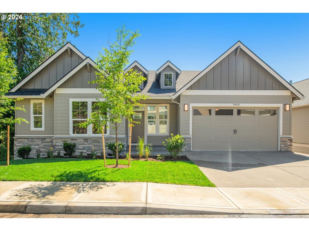 a view of a house with a yard and plants