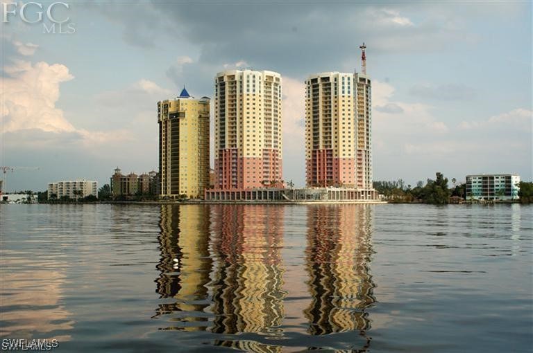 a view of a lake with tall buildings