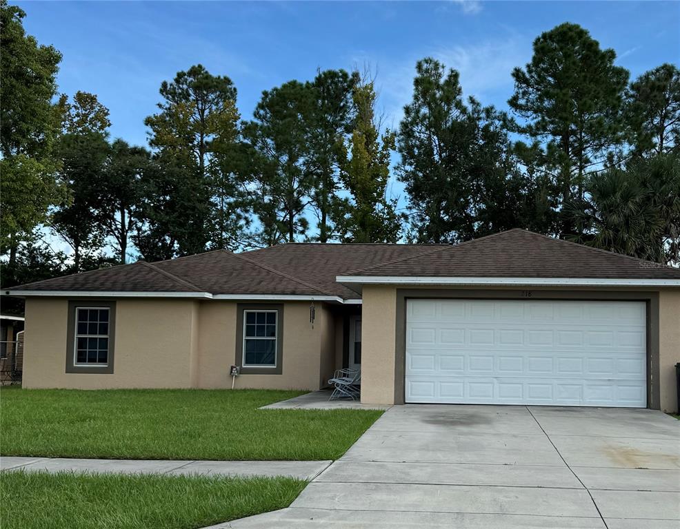 front view of a house with a yard