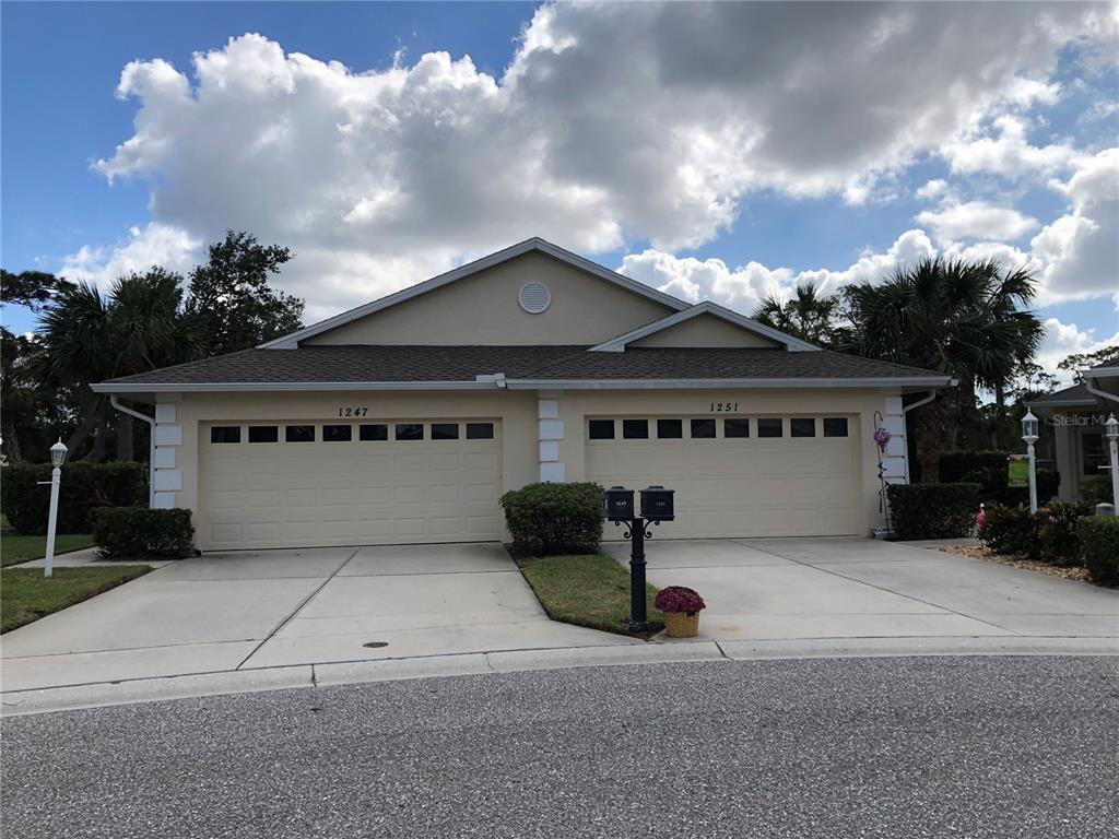 a front view of a house with a garage