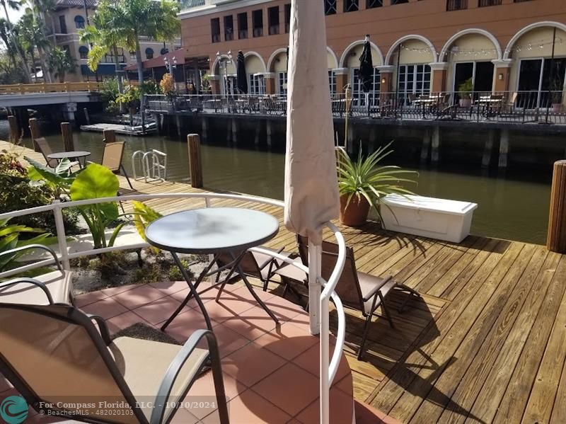 a view of a chairs and table in patio