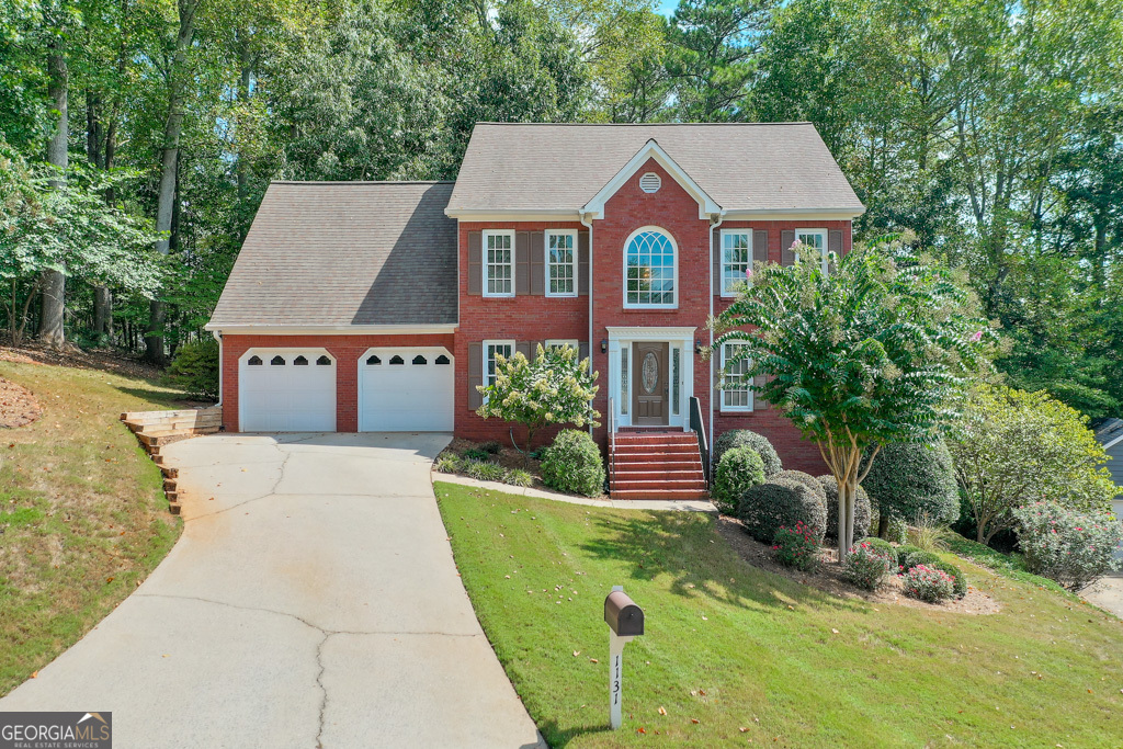 a aerial view of a house with a yard