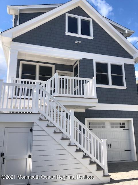 a view of a house with wooden deck