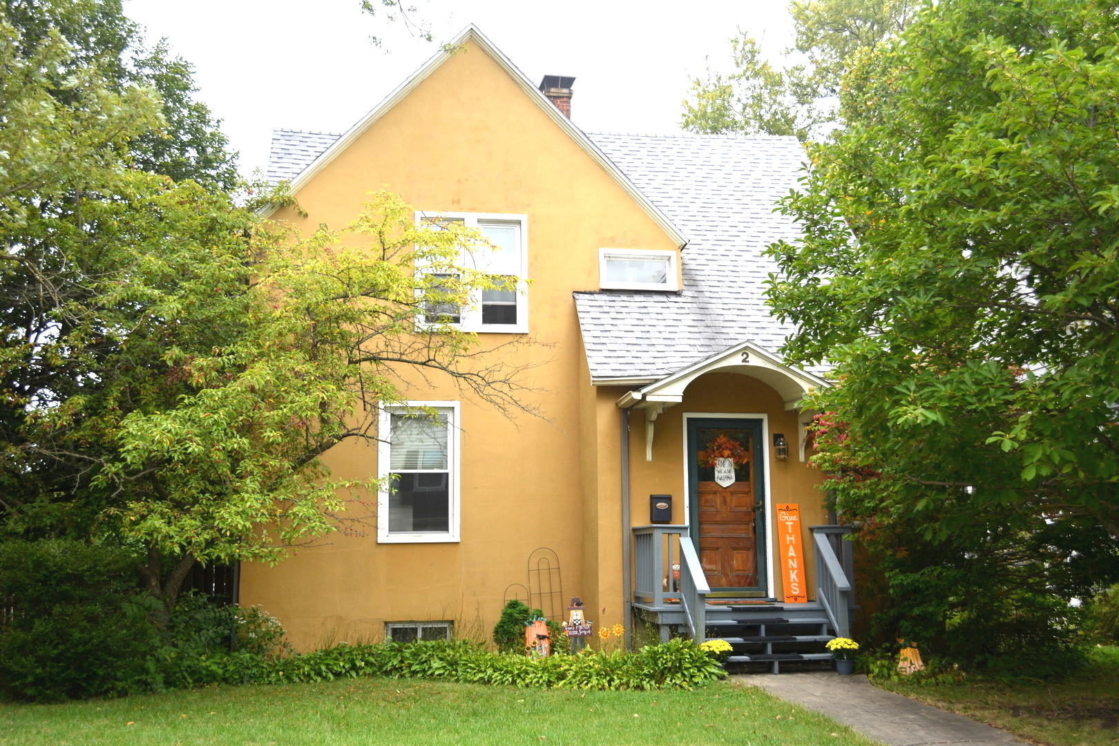 front view of a house with a yard