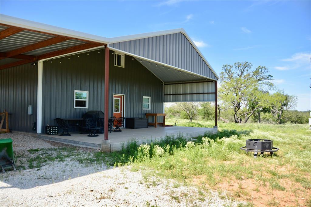 a front view of house with yard and outdoor seating