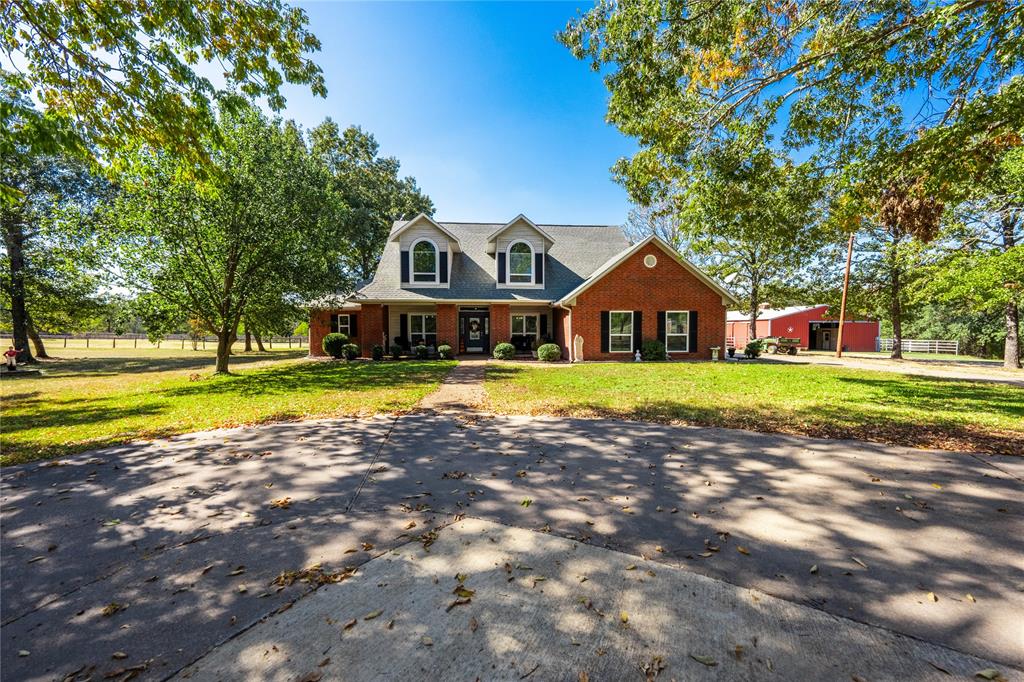 a view of a house with a big yard