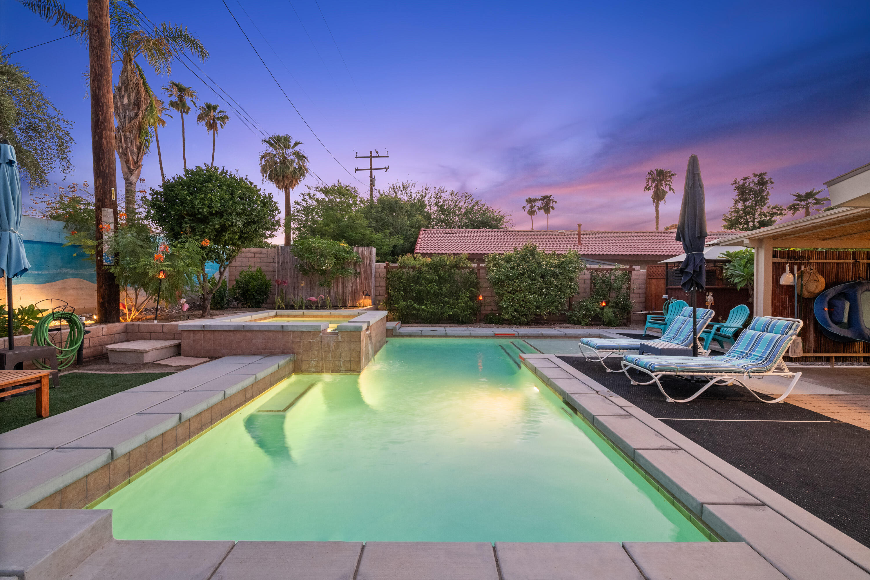 a view of a swimming pool with a lounge chairs