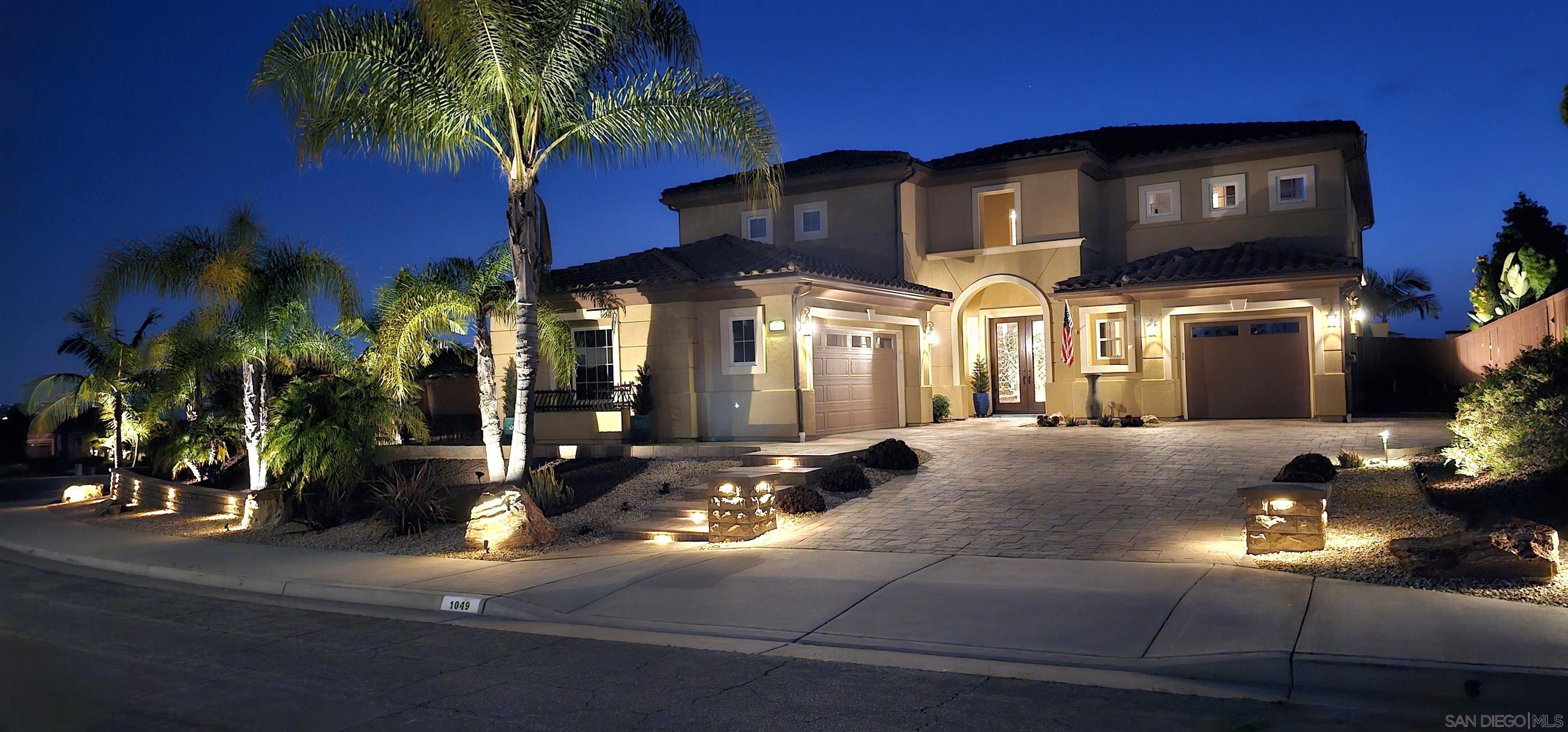 a front view of a house with yard