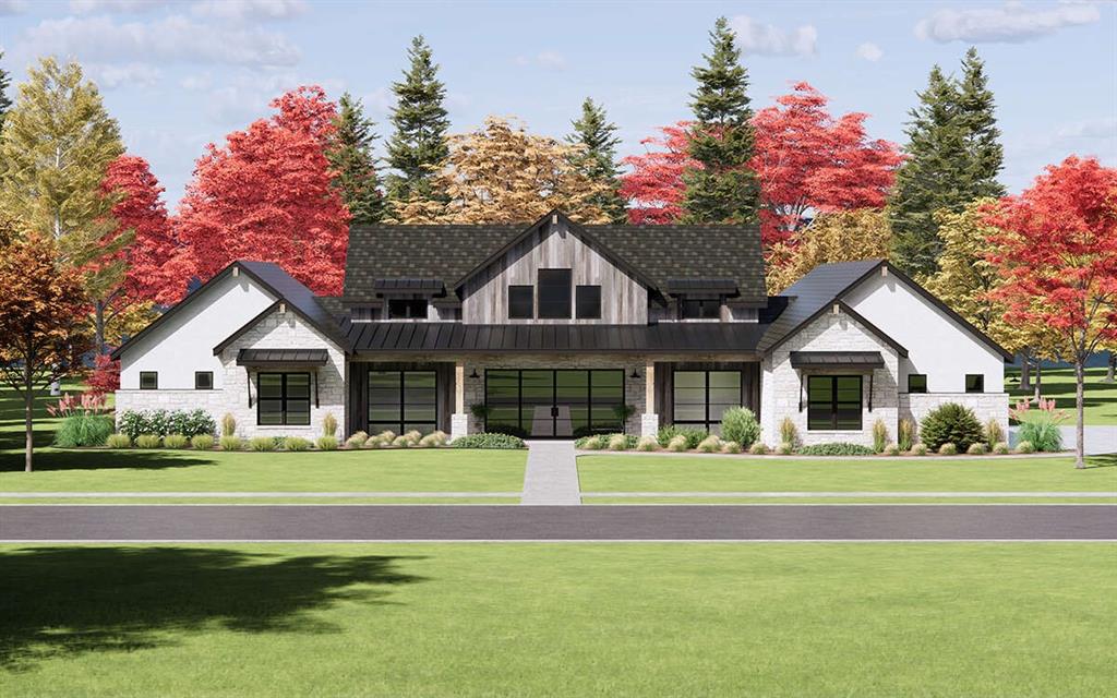 a front view of a house with a garden and trees