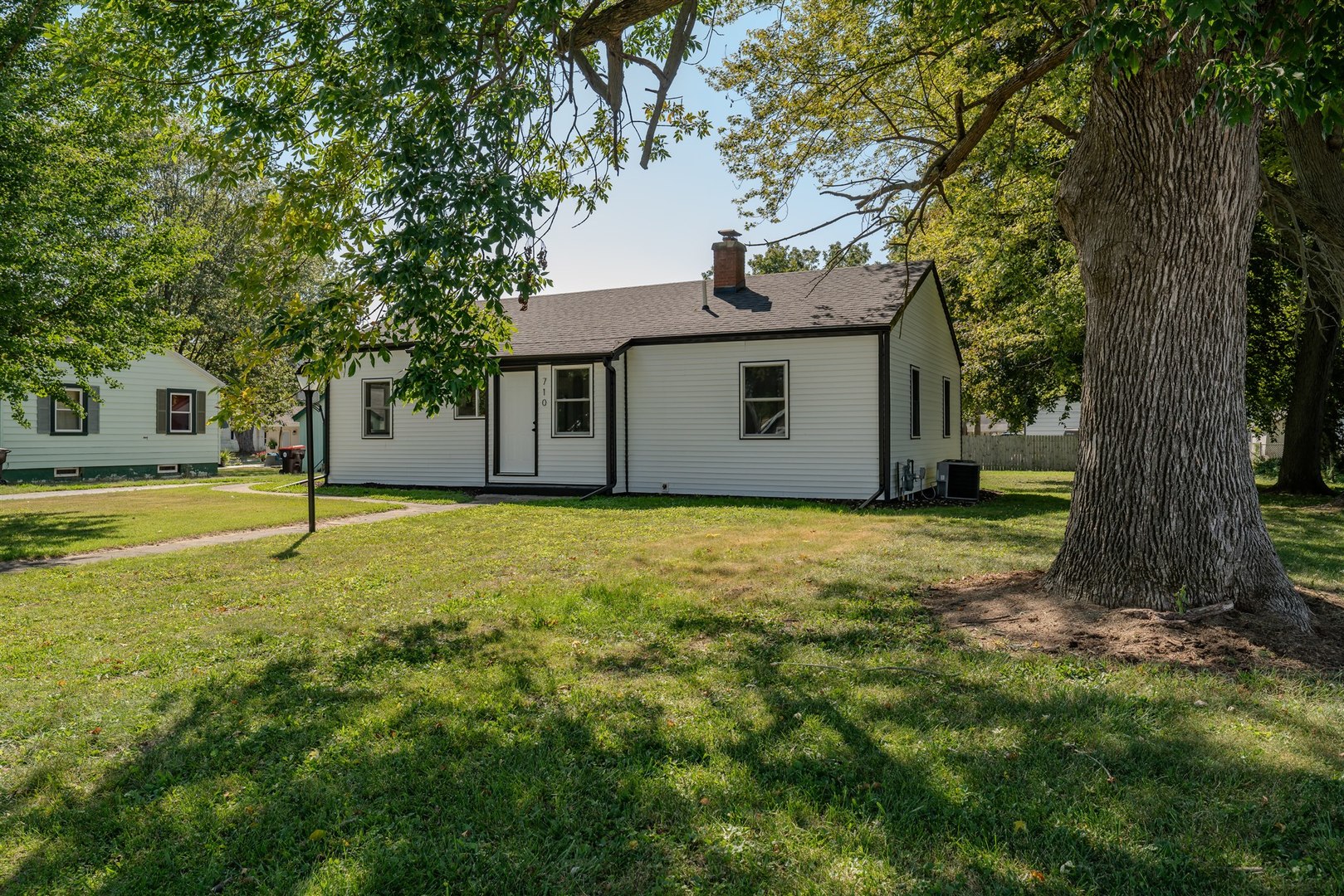 a house with trees in front of it