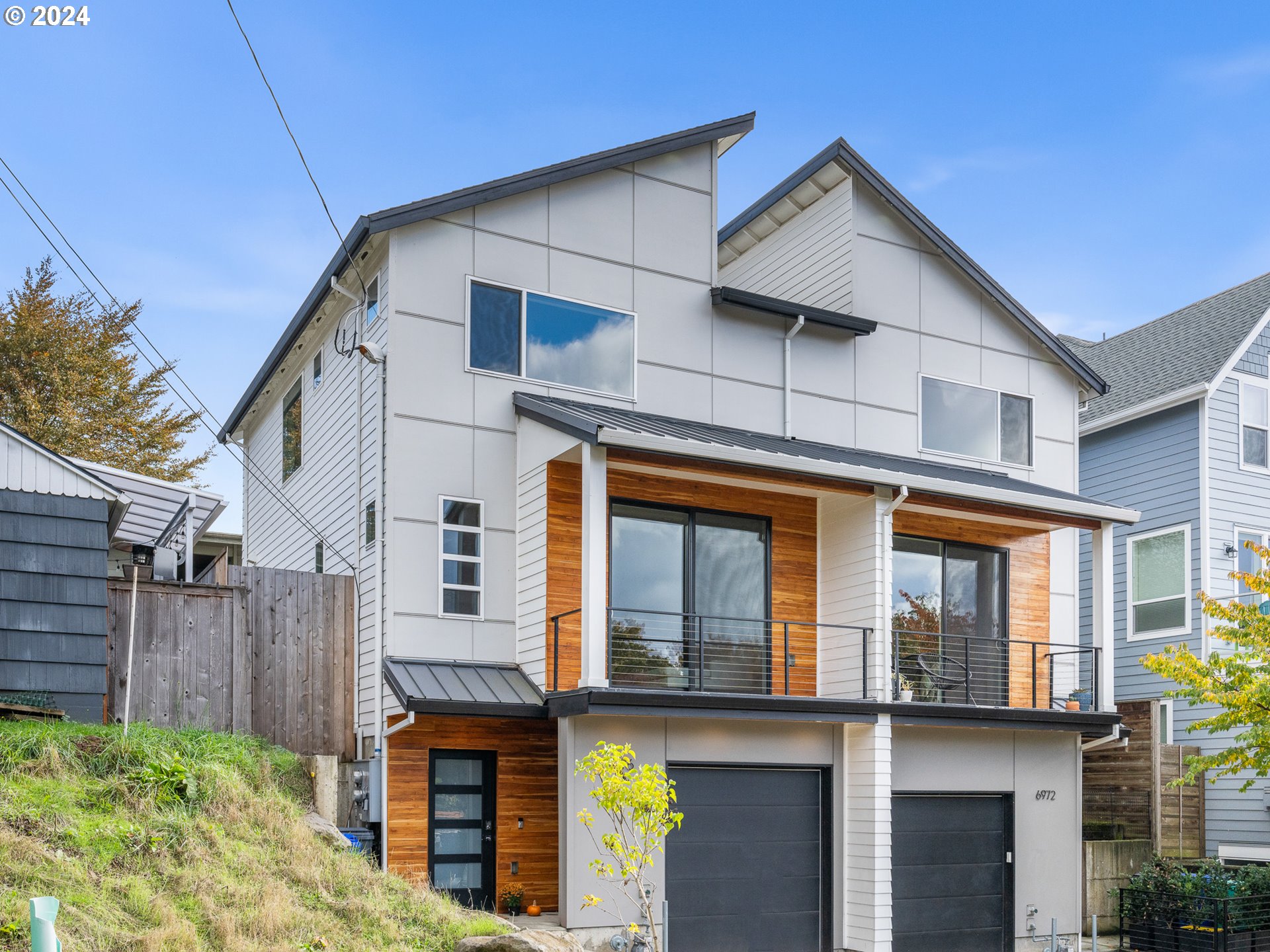 a front view of a house with glass windows