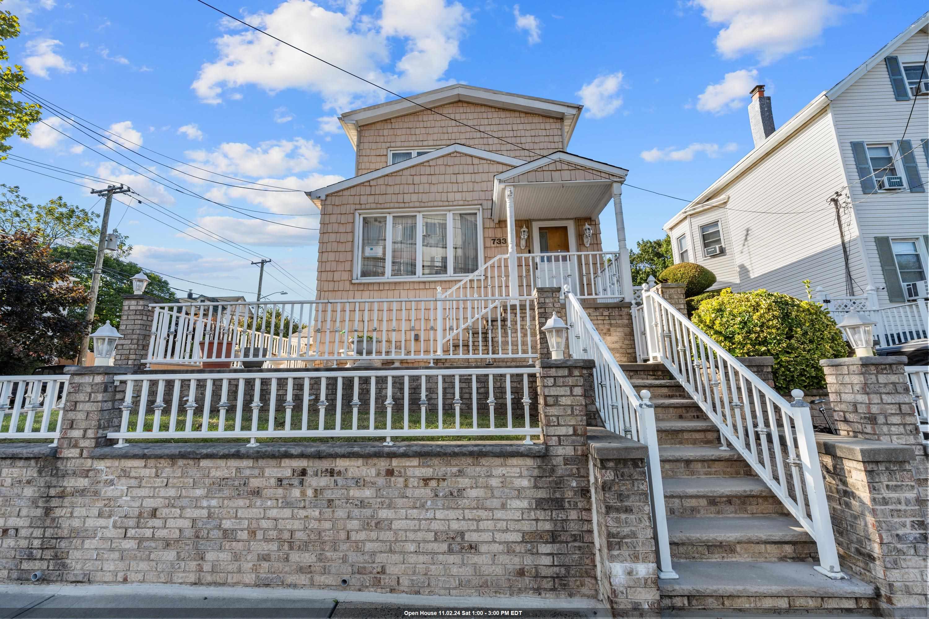 a view of a house with wooden deck