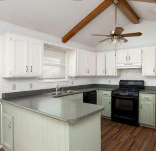 a kitchen with stainless steel appliances granite countertop a sink a stove and cabinets