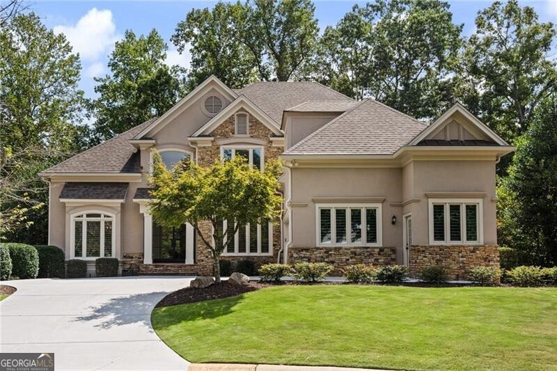 a front view of a house with a yard