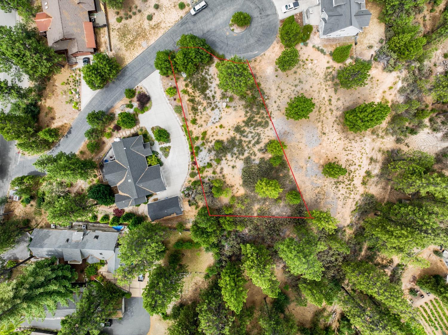 an aerial view of residential houses with yard