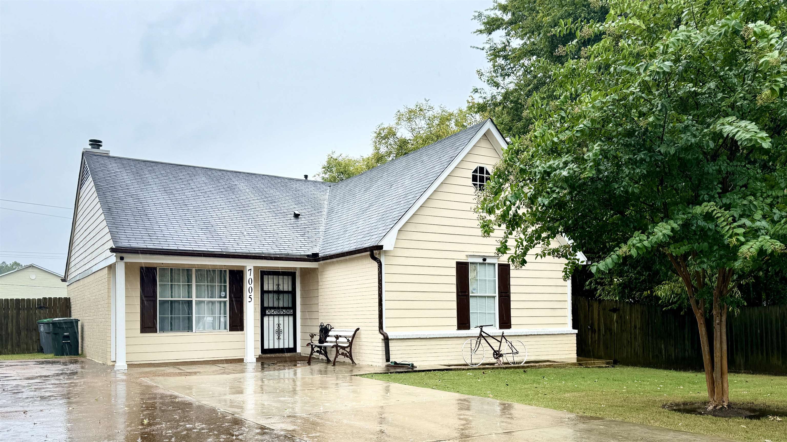 a front view of a house with garden