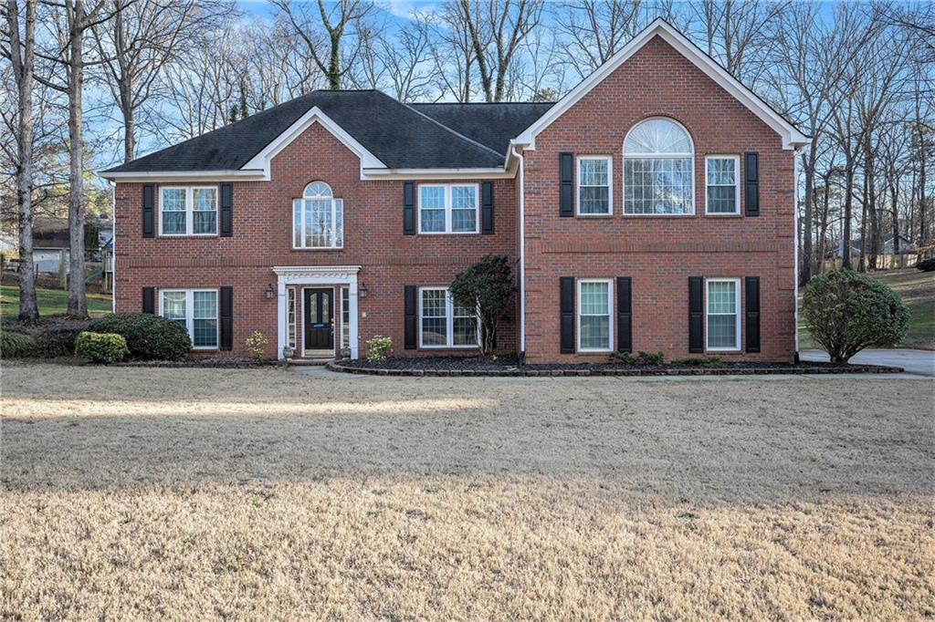 front view of a house with a yard