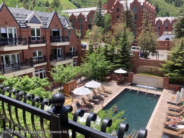 an aerial view of a house with garden space and street view