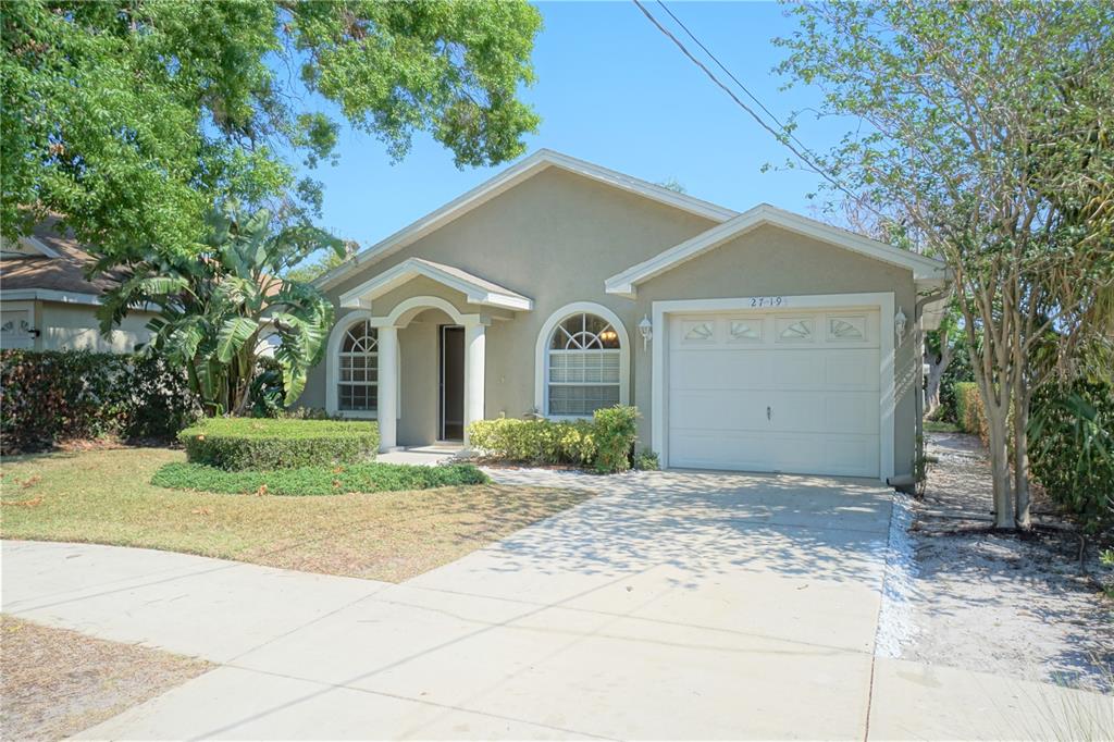 a view of a house with a yard