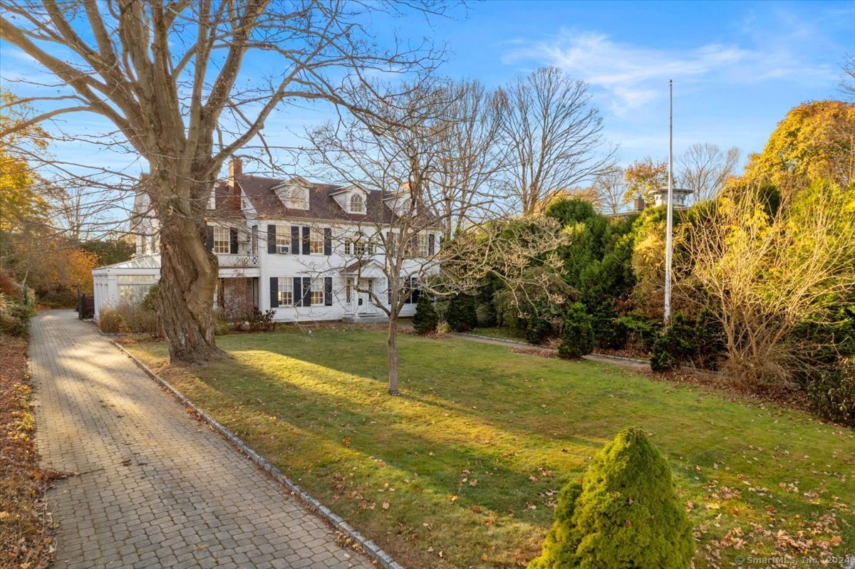 a view of a house with a large trees