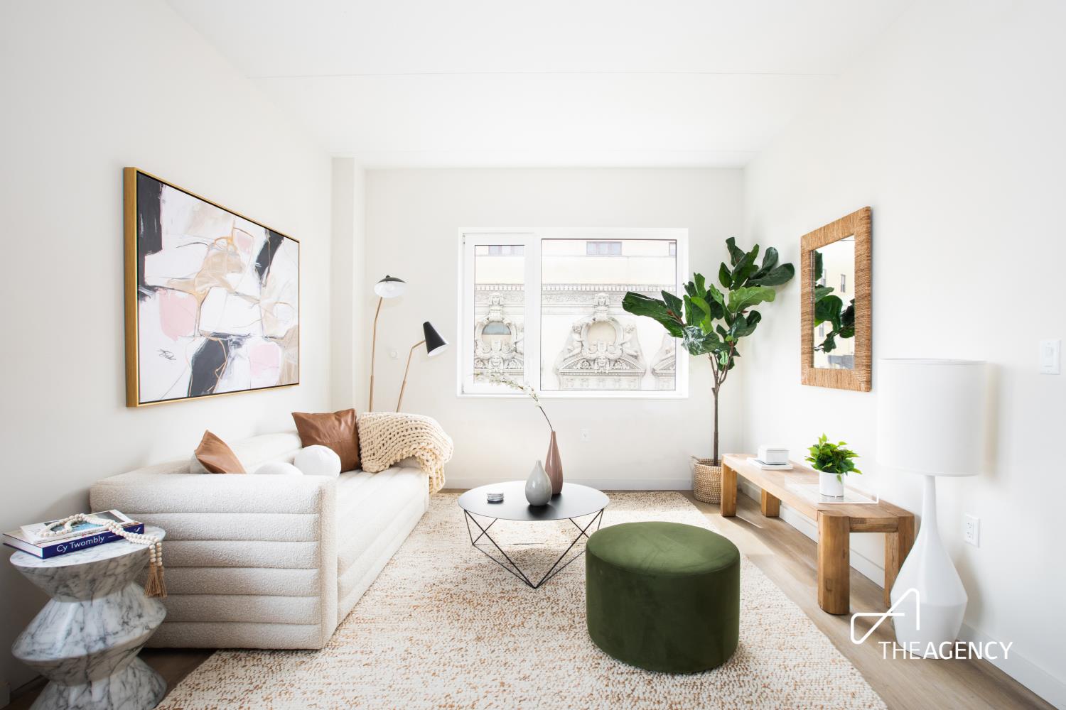 a living room with furniture and a potted plant