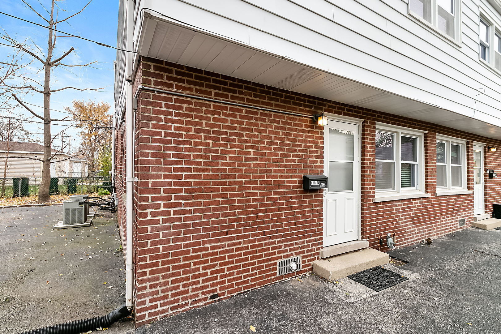 a view of a brick house with a door