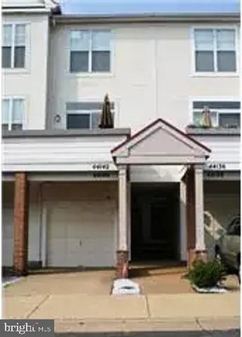 a front view of a house with garage