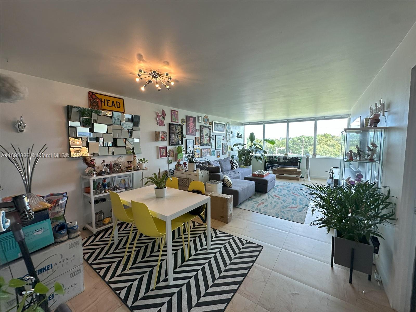 a view of a livingroom with furniture and a potted plant