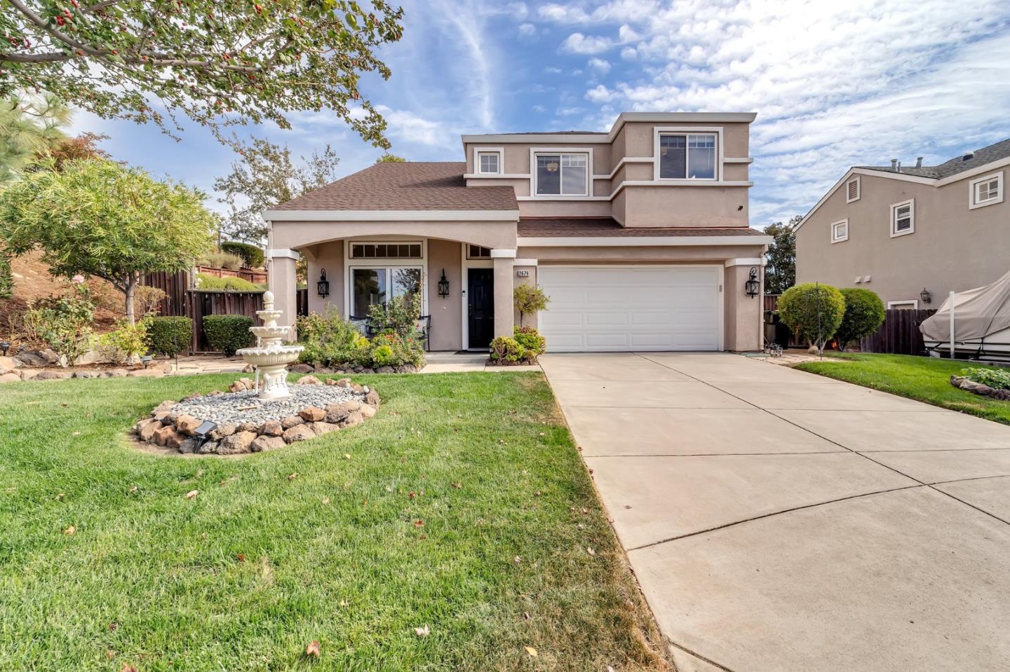 a front view of a house with a yard outdoor seating and entertaining space