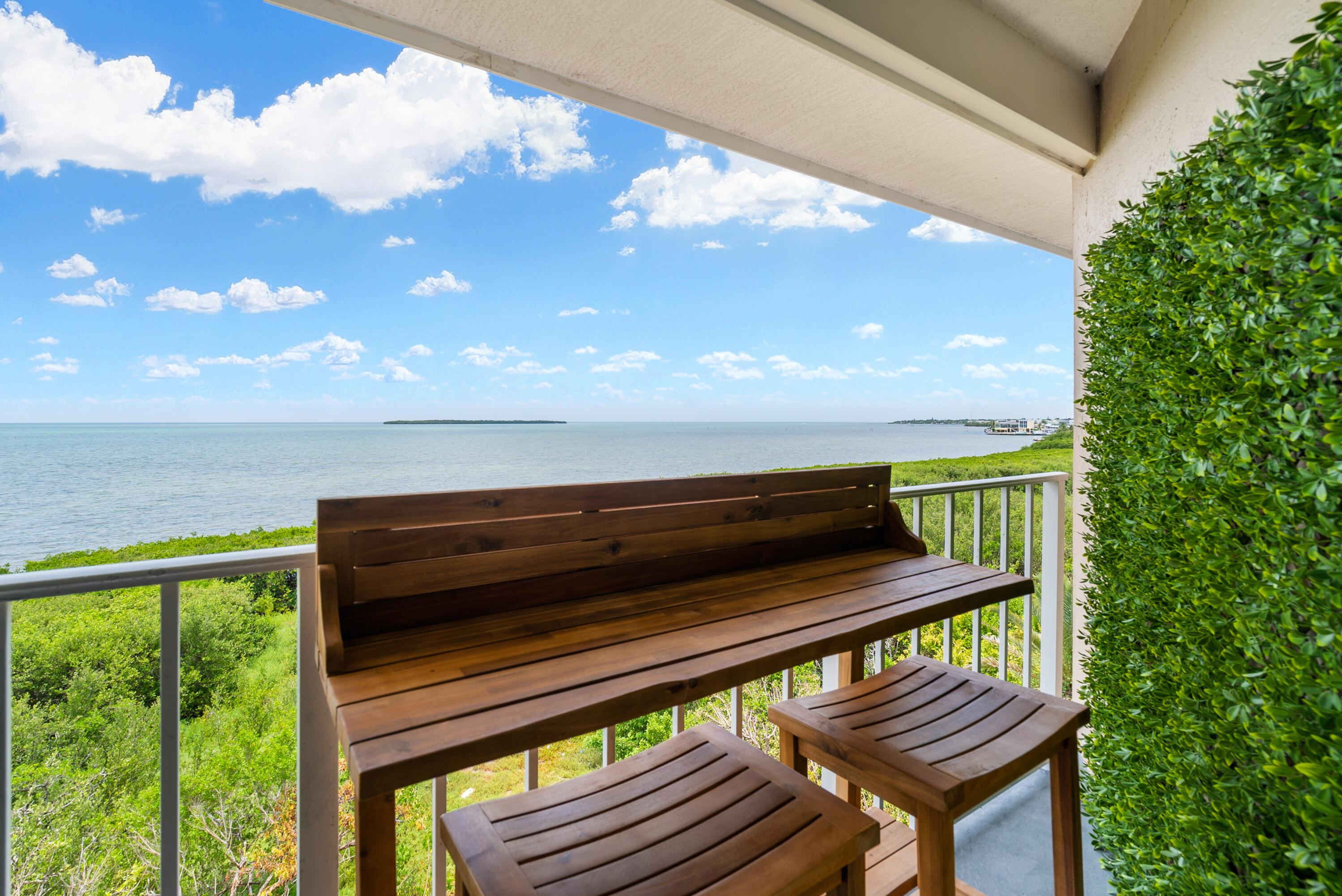 a view of sitting area with furniture and wooden deck