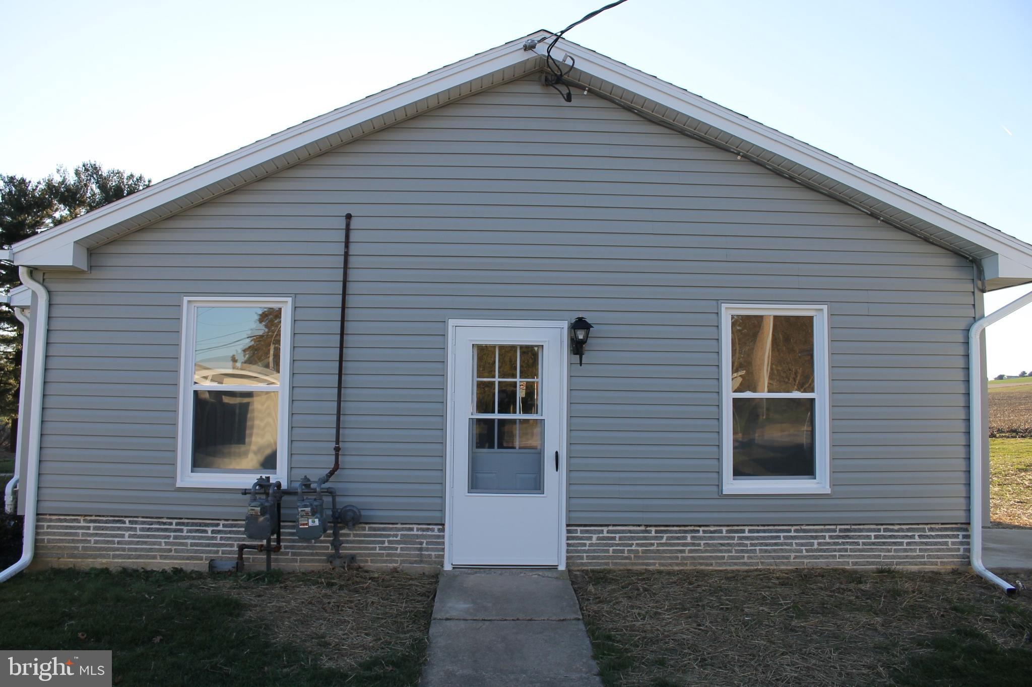 a front view of house with yard