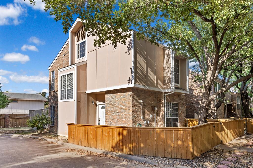 front view of a house with a trees