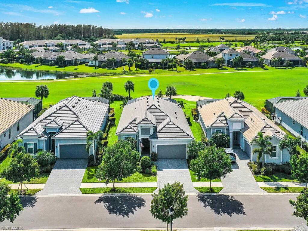 Impressive curb appeal with serene golf course backdrop.