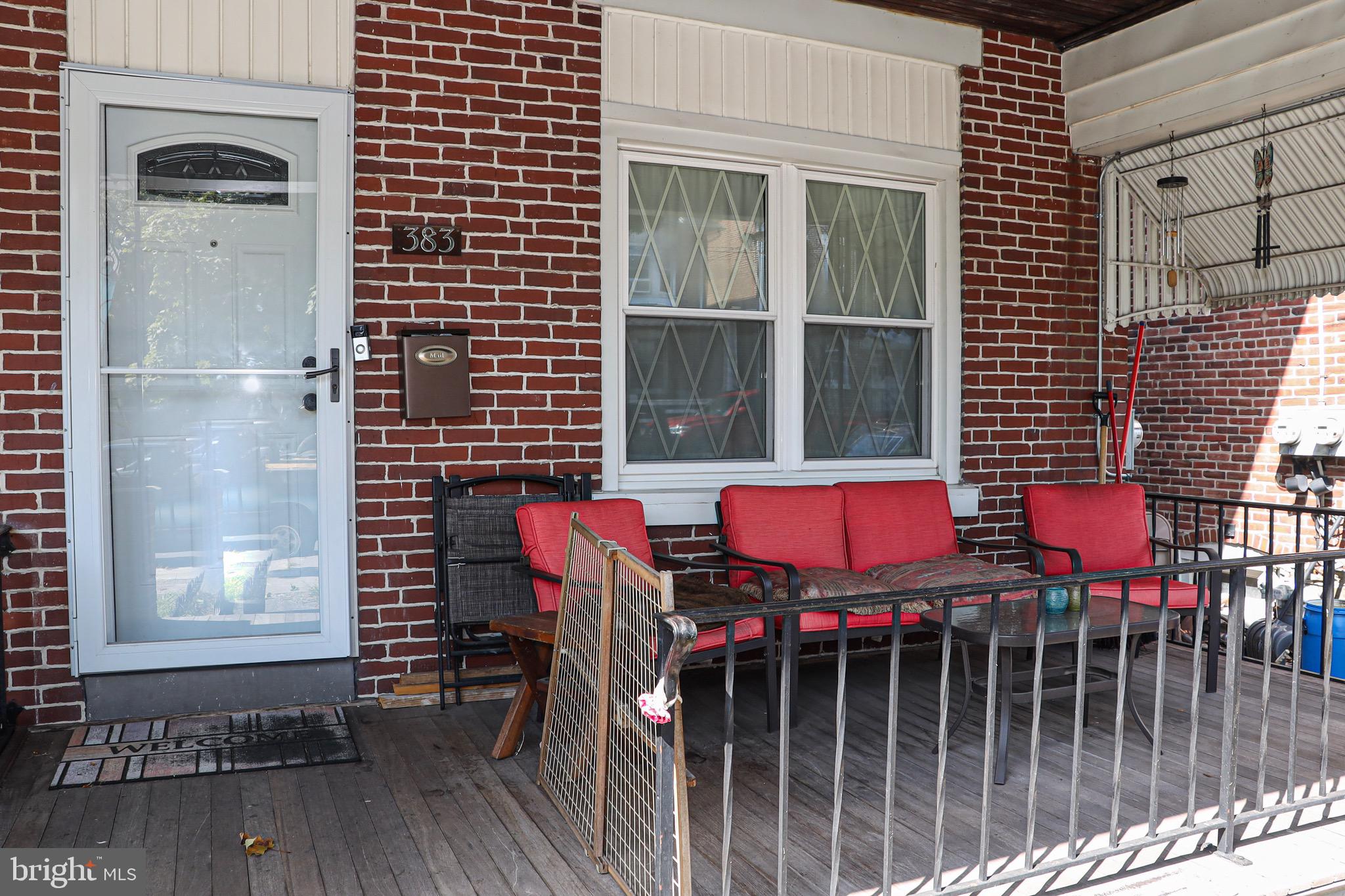 a view of a chairs and table in the balcony