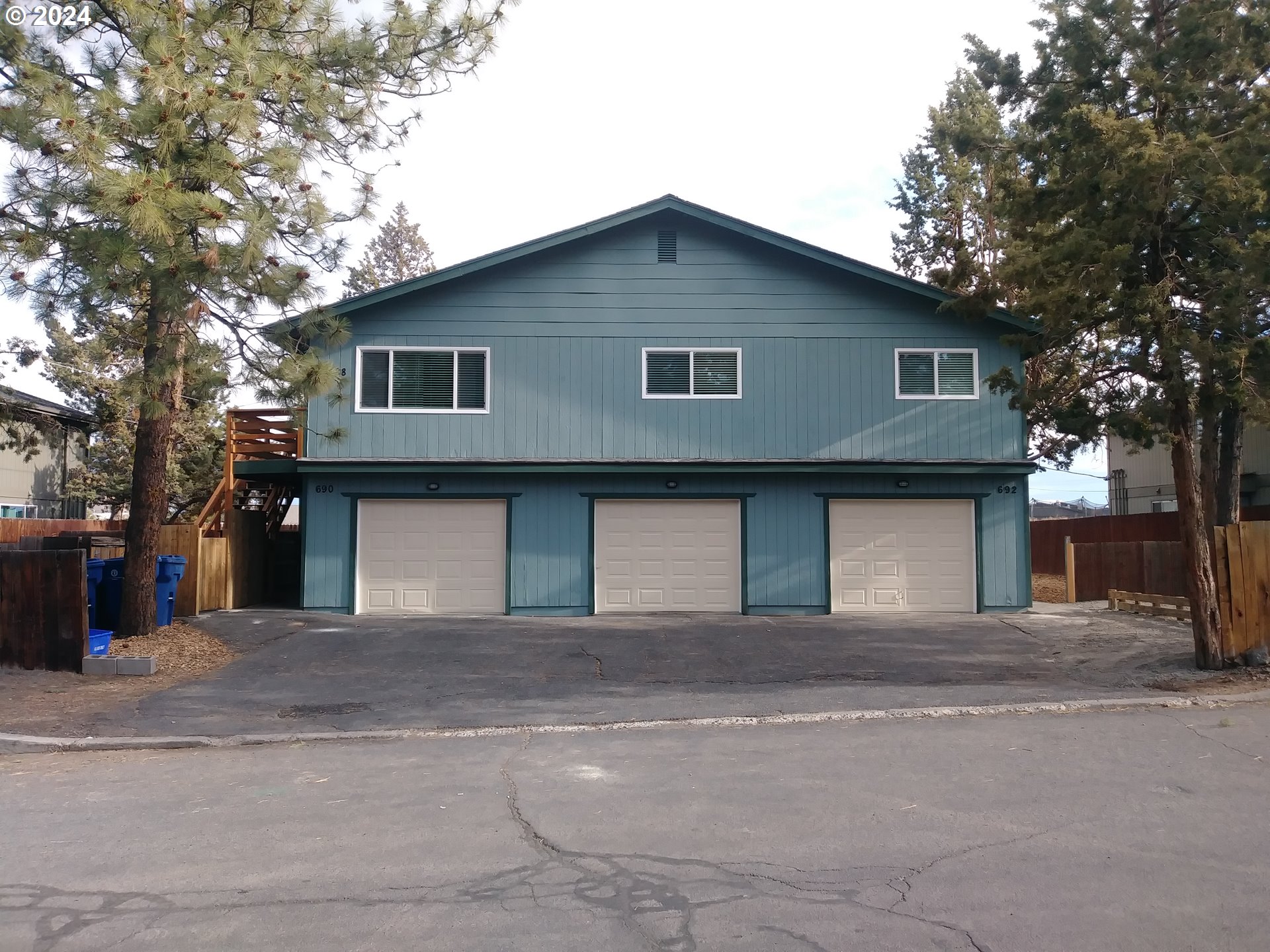 a front view of a house with a garage