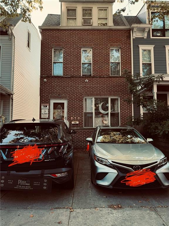 a car parked in front of a house