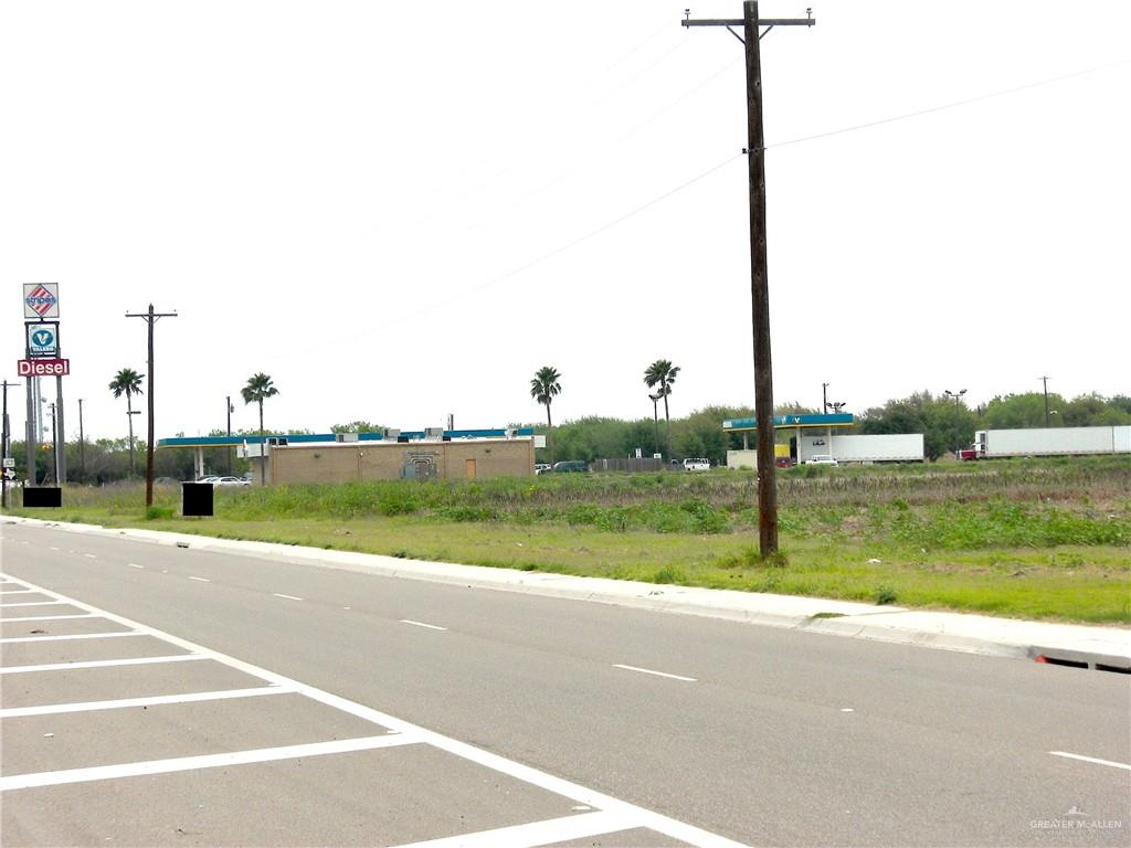 a view of a road with a big yard