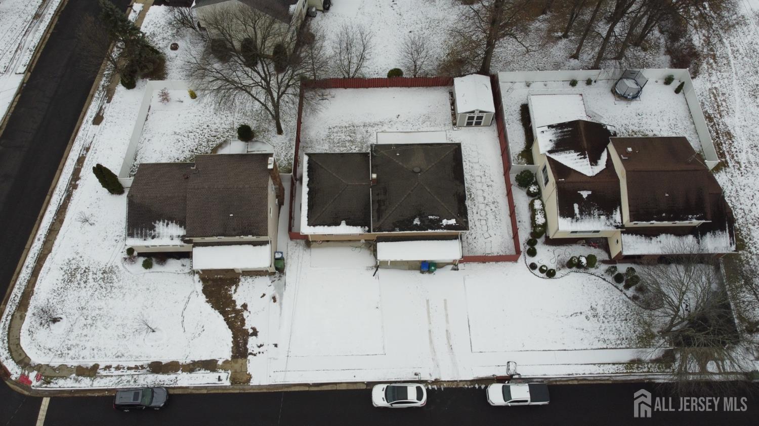 an aerial view of a fireplace with table and chairs