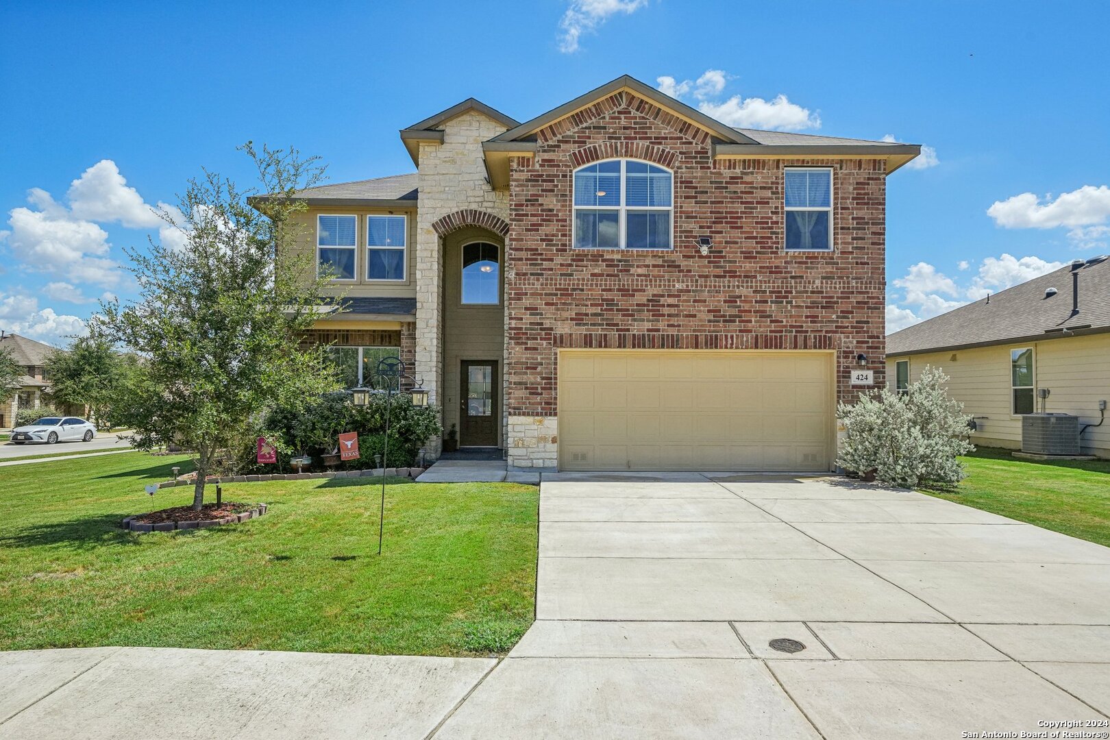 a front view of a house with a yard