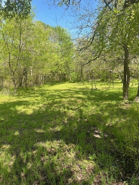 a view of a field with an trees