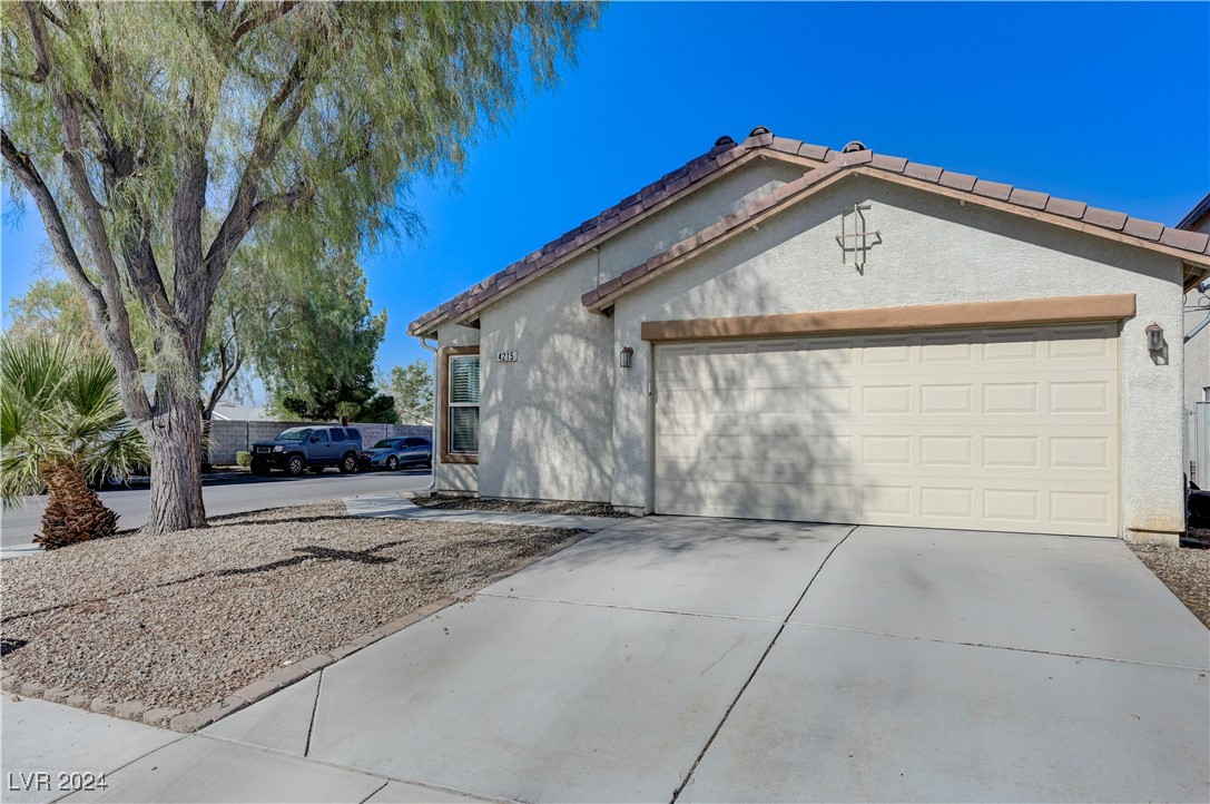 Front of the house with 2 cars garage