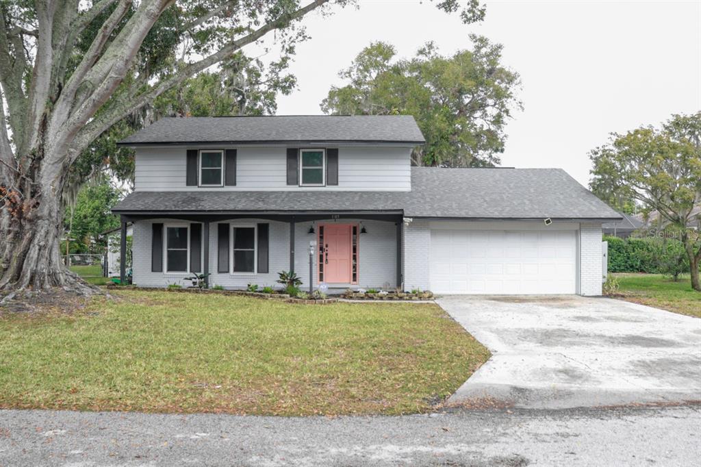 a front view of a house with a yard