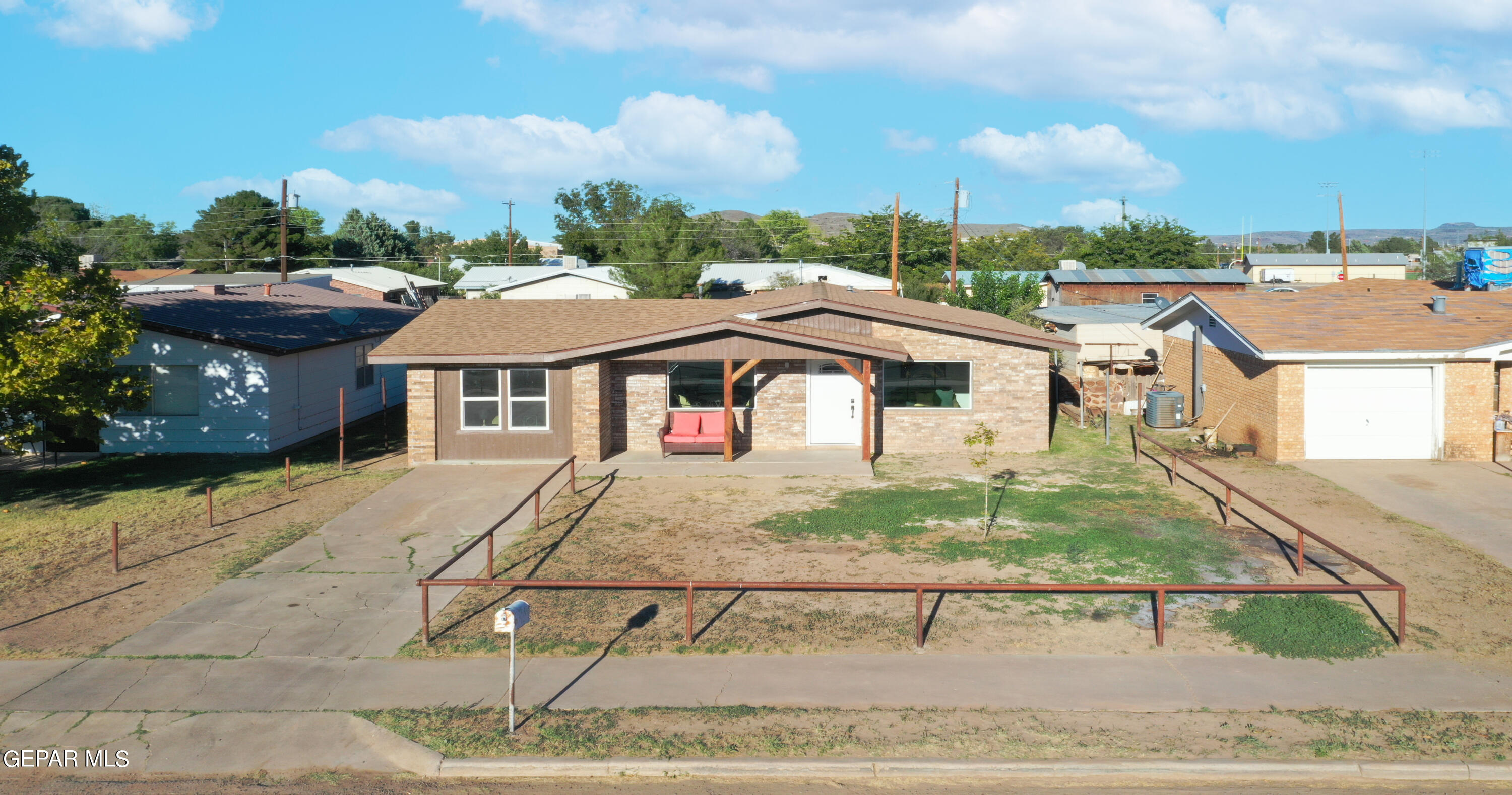 a view of multiple houses with a street