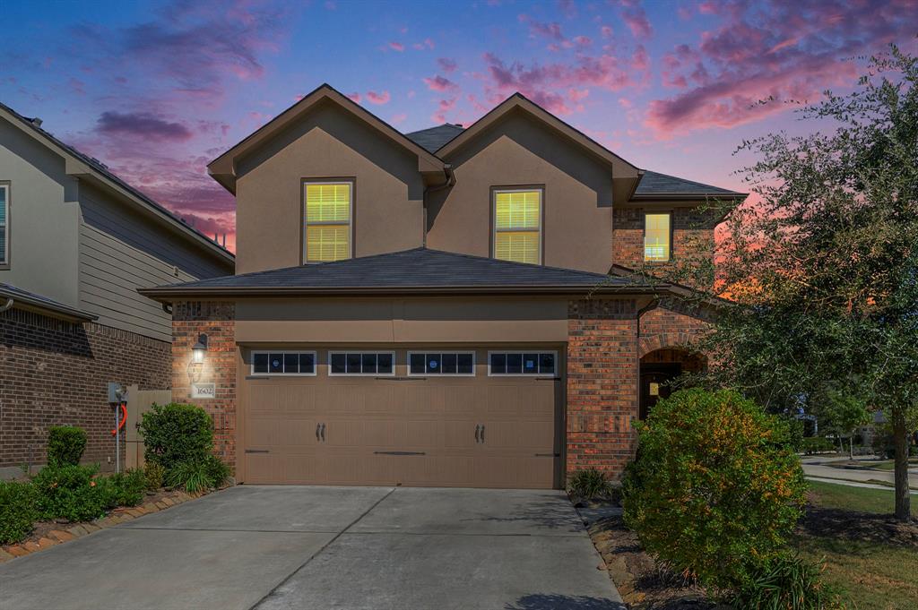 a front view of a house with a garage